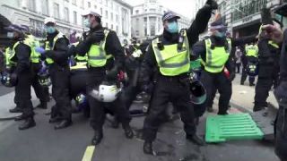 Police in London tried to break up anti-lockdown and anti-vaccine protest
